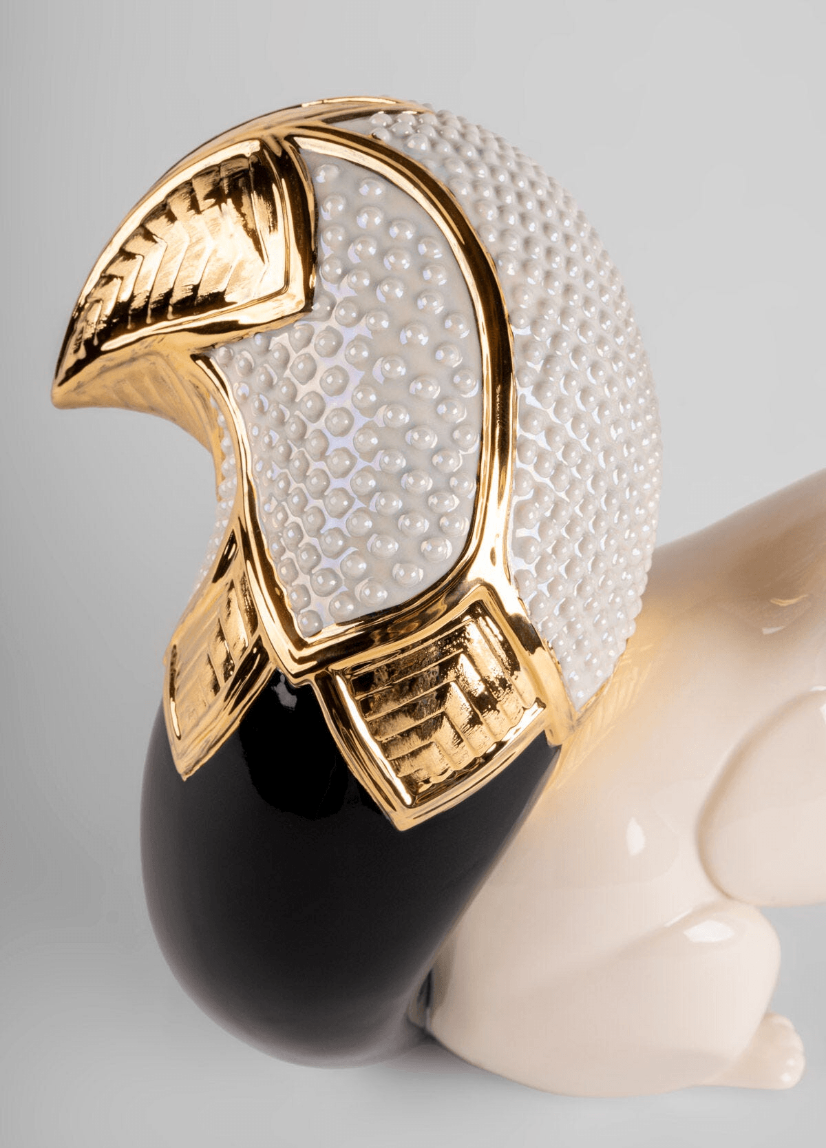Lladró - Squirrel Jewel Sculpture featuring intricate golden and pearl detailing in porcelain.