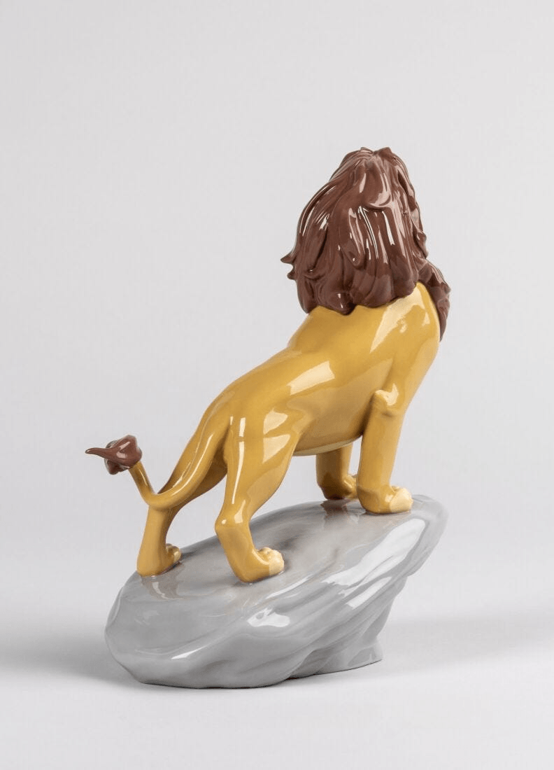 Lladró - Simba Figurine made of porcelain, depicting a proud lion on a rock base in detailed colors.
