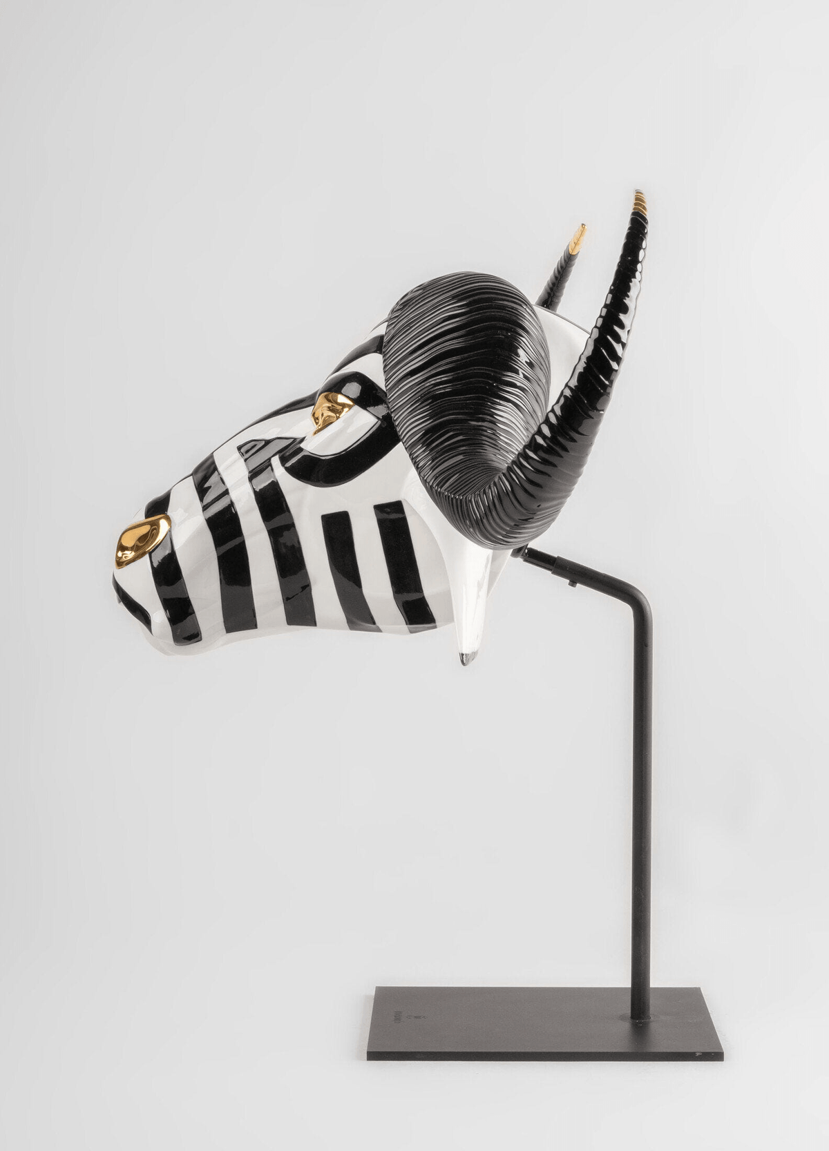 Lladró - Buffalo Mask - Black and Gold handcrafted porcelain sculpture with black and gold details.