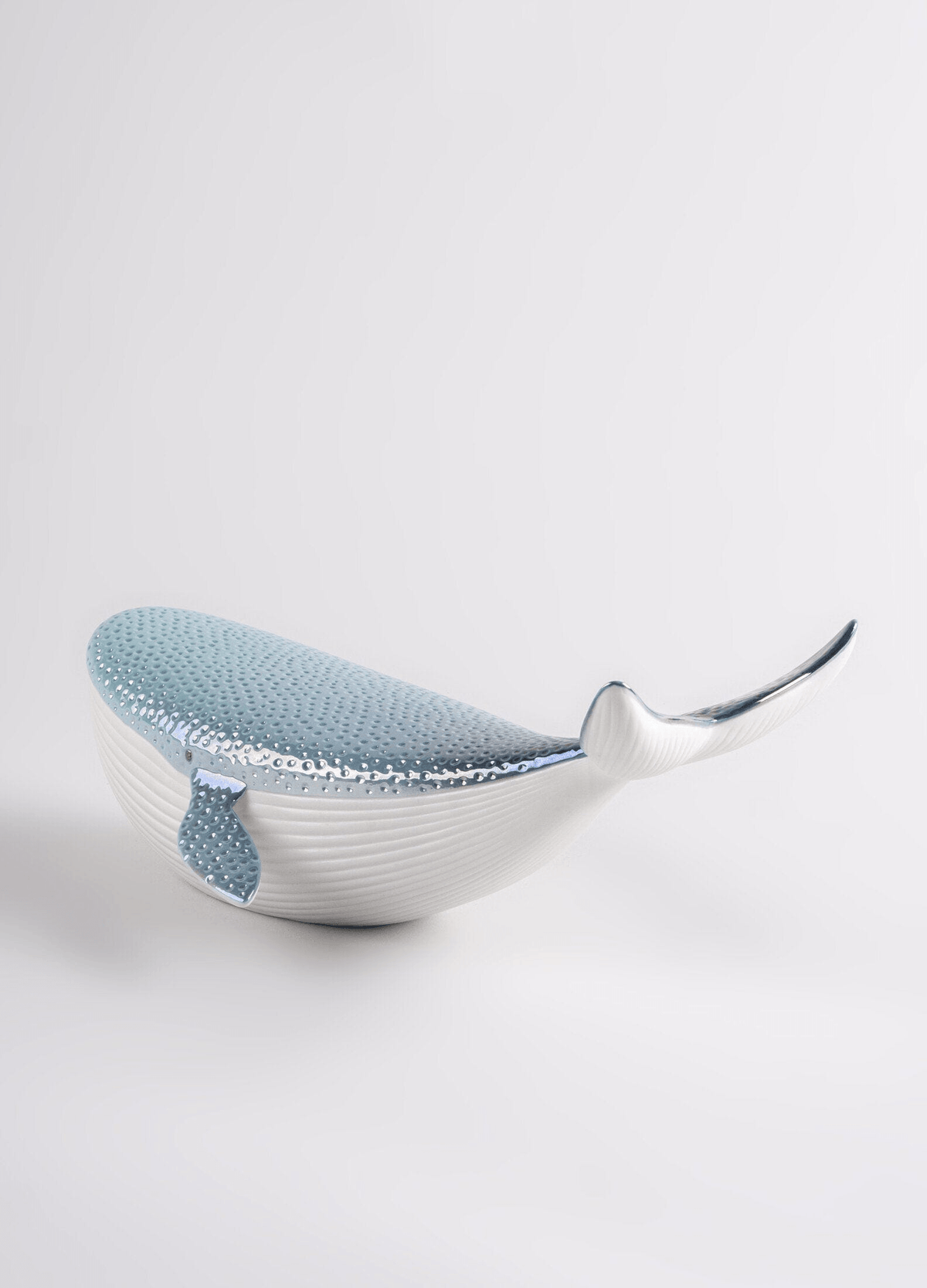 Lladró - Little Whale decorative porcelain piece in white and blue finish, symbolizing the beauty of the sea.