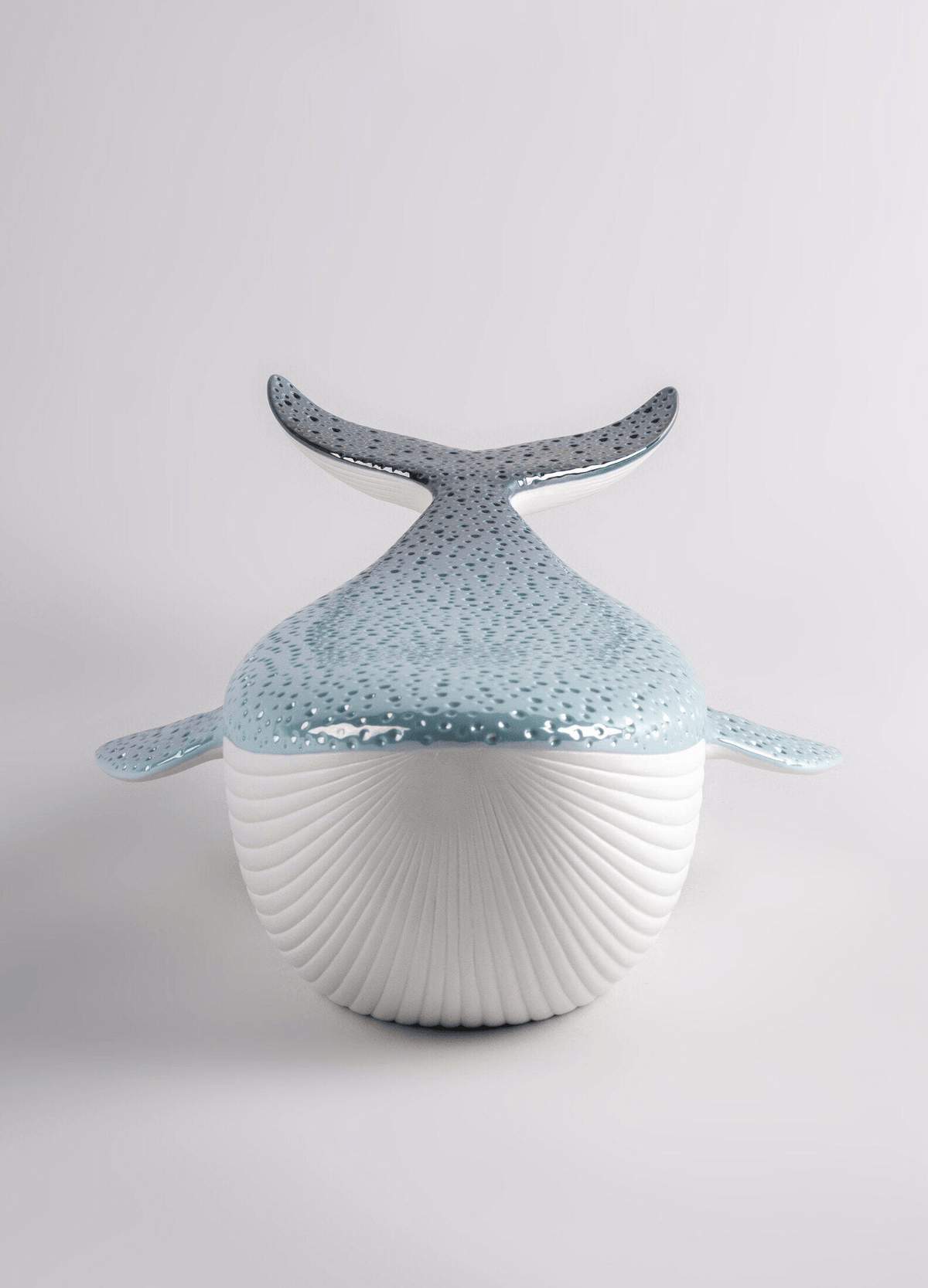 Lladró - Whale porcelain decorative piece with blue and white finish, symbolizing beauty of the ocean.