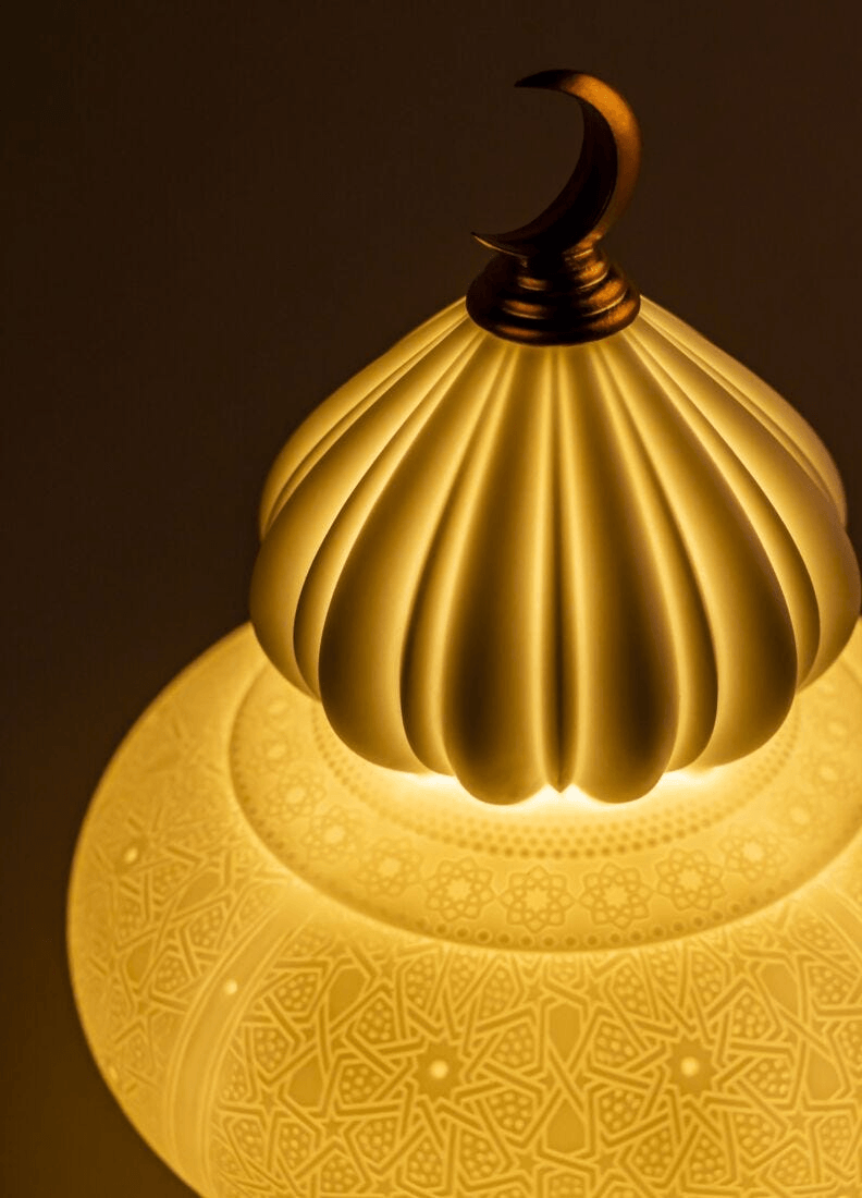 Lladró - Majestic Nights wireless Lamp - Champagne illuminating with intricate porcelain design and warm light.