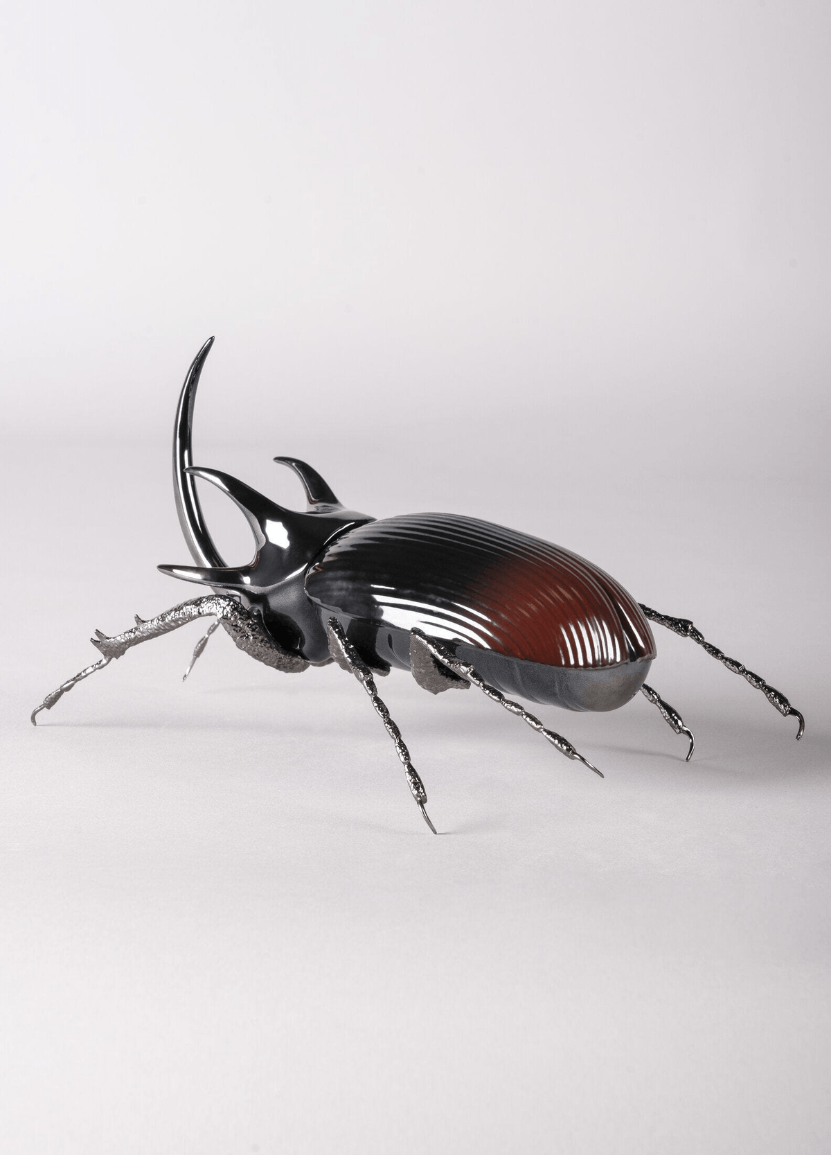 Lladró - Rhinoceros Beetle Figurine made of porcelain with brass legs, ideal for collectors and nature lovers.