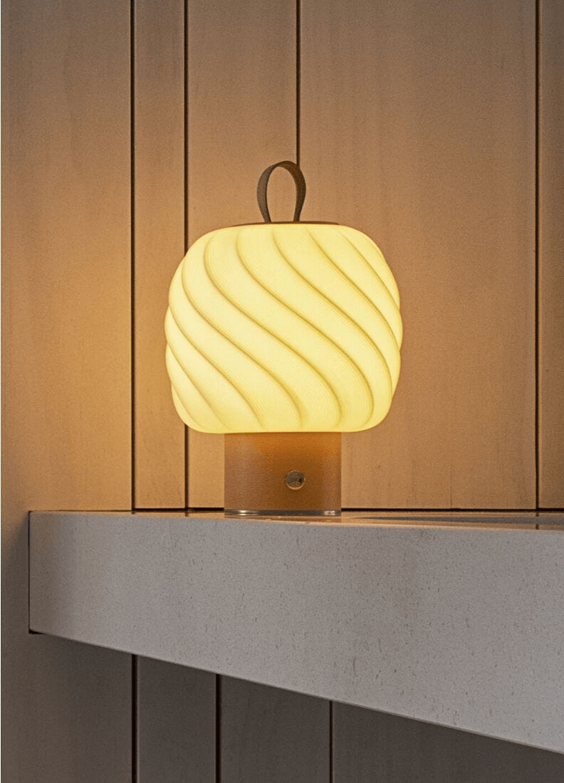 Lladró - Ice Cream portable lamp - Medium - Nude on a shelf, glowing, showcasing the porcelain texture.