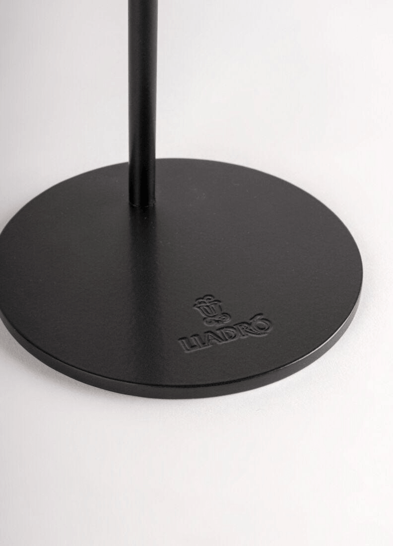 Lladró logo on a black base, showcasing elegance and craftsmanship in porcelain.