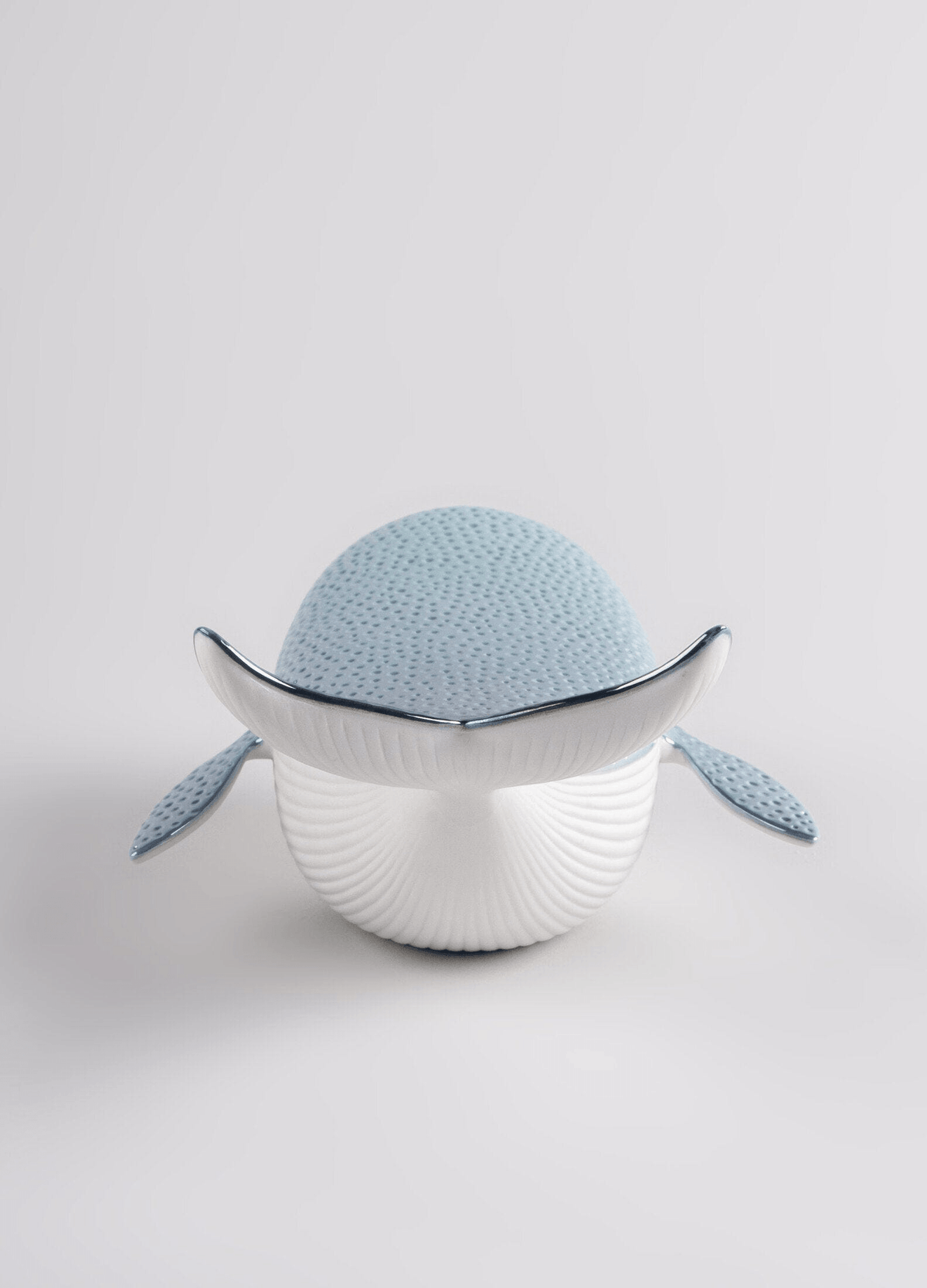 Lladró - Little Whale porcelain decorative piece in white and blue, showcasing a contemporary design.