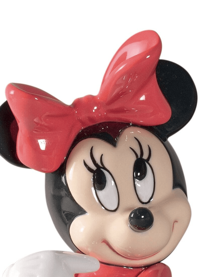 Lladró - Minnie Mouse Figurine featuring her iconic bow and cheerful expression in fine porcelain.