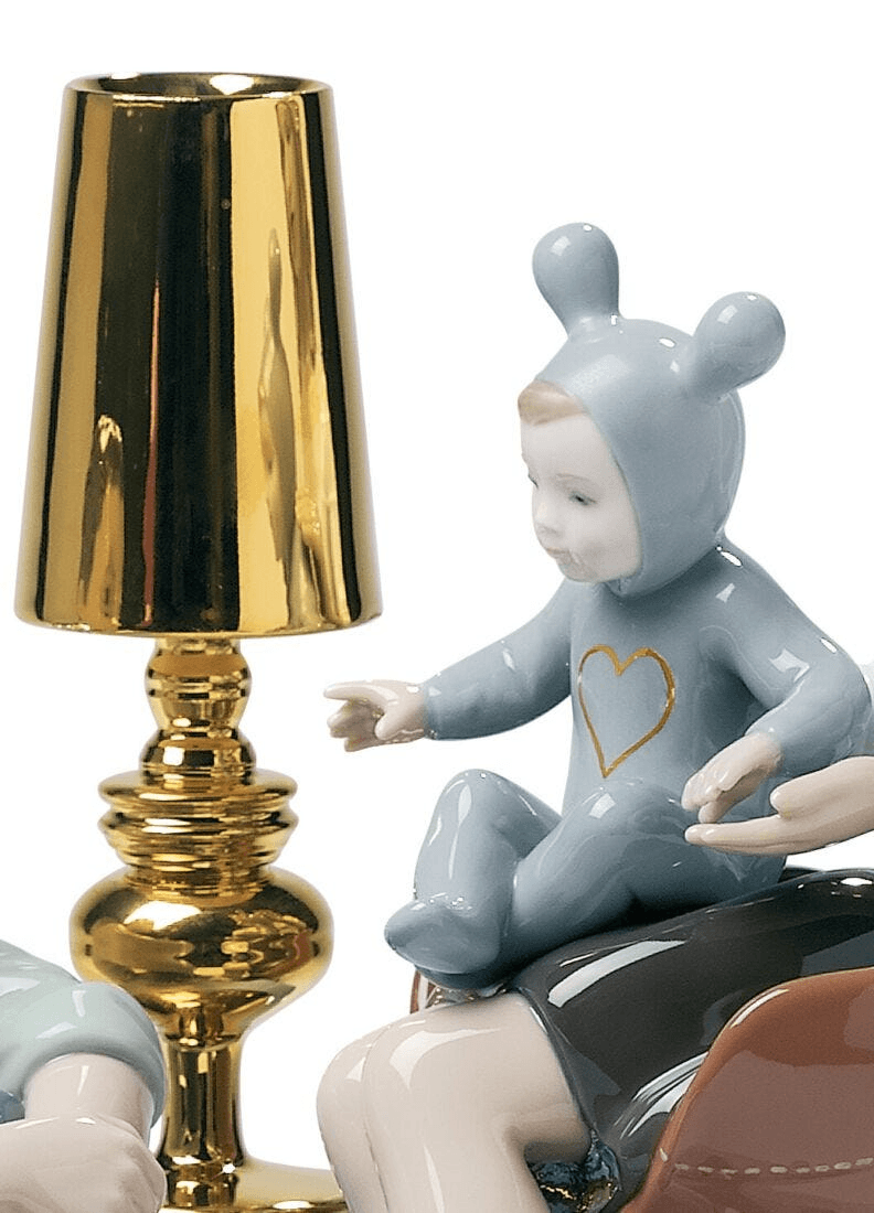 Lladró - The Family Portrait Sculpture featuring a porcelain child next to a gold lamp