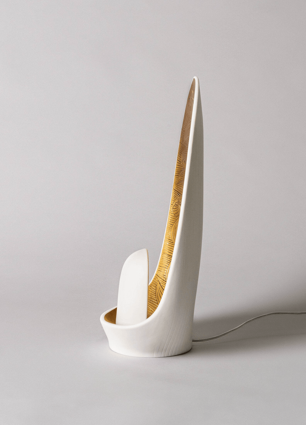 Lladró - Mirage Table Lamp in white porcelain with golden luster finish, showcasing elegant design.