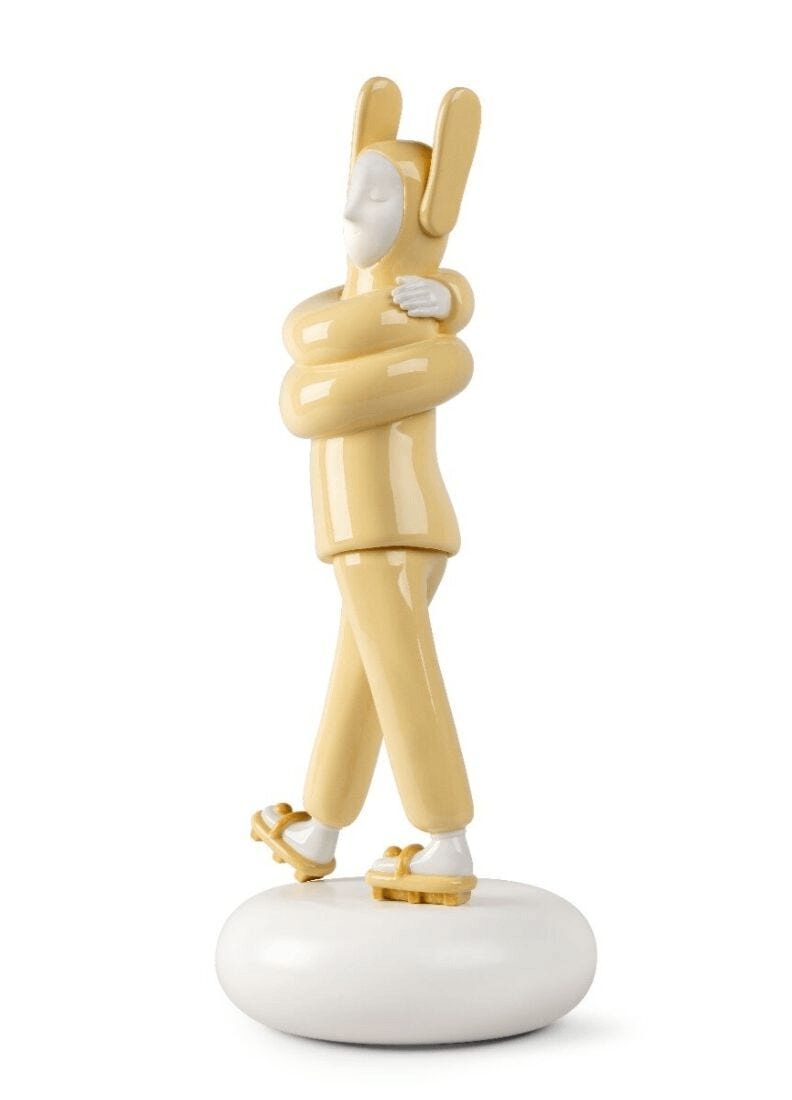 Lladró - Embraced Sculpture - Yellow, a porcelain sculpture by Jaime Hayon featuring a character embracing itself.