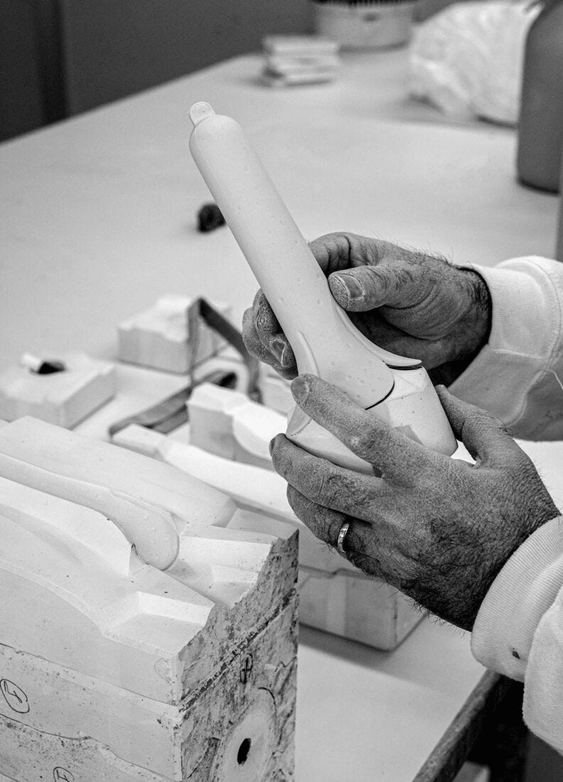 Craftsman working on Lladró - Seasons Wall sconce - Winter porcelain piece, showcasing artistry in creation.