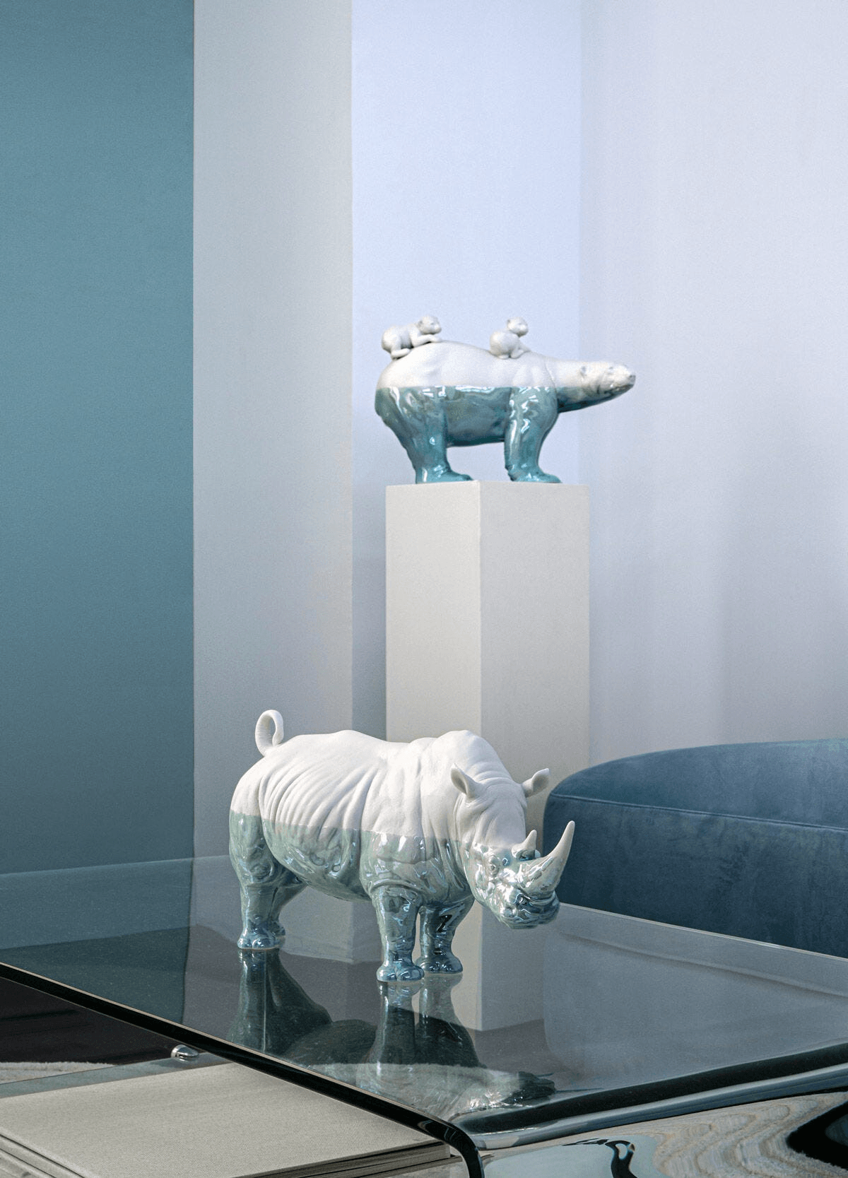 Lladró - Rhino - Underwater Sculpture displayed on a glass table, showcasing porcelain craftsmanship.