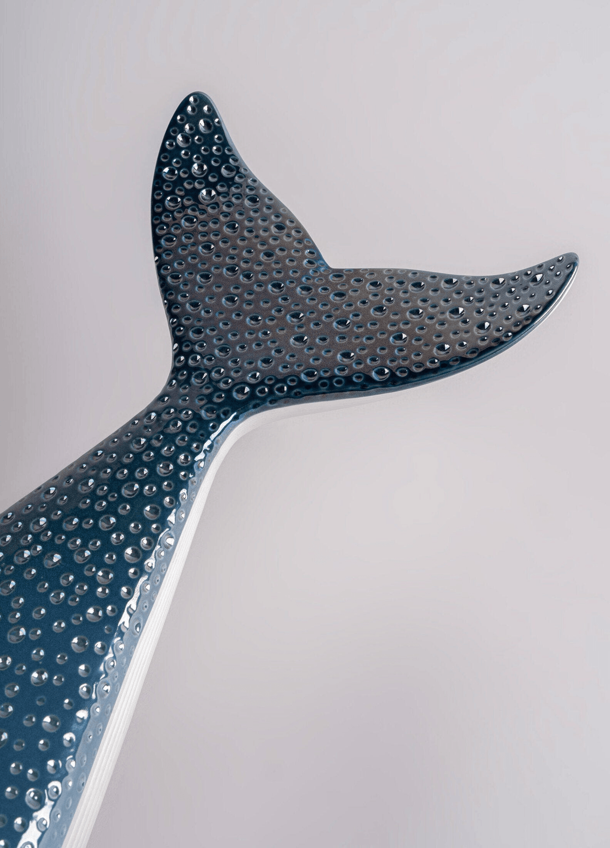 Lladró - Whale decorative porcelain piece featuring a beautifully detailed whale tail in blue and white.