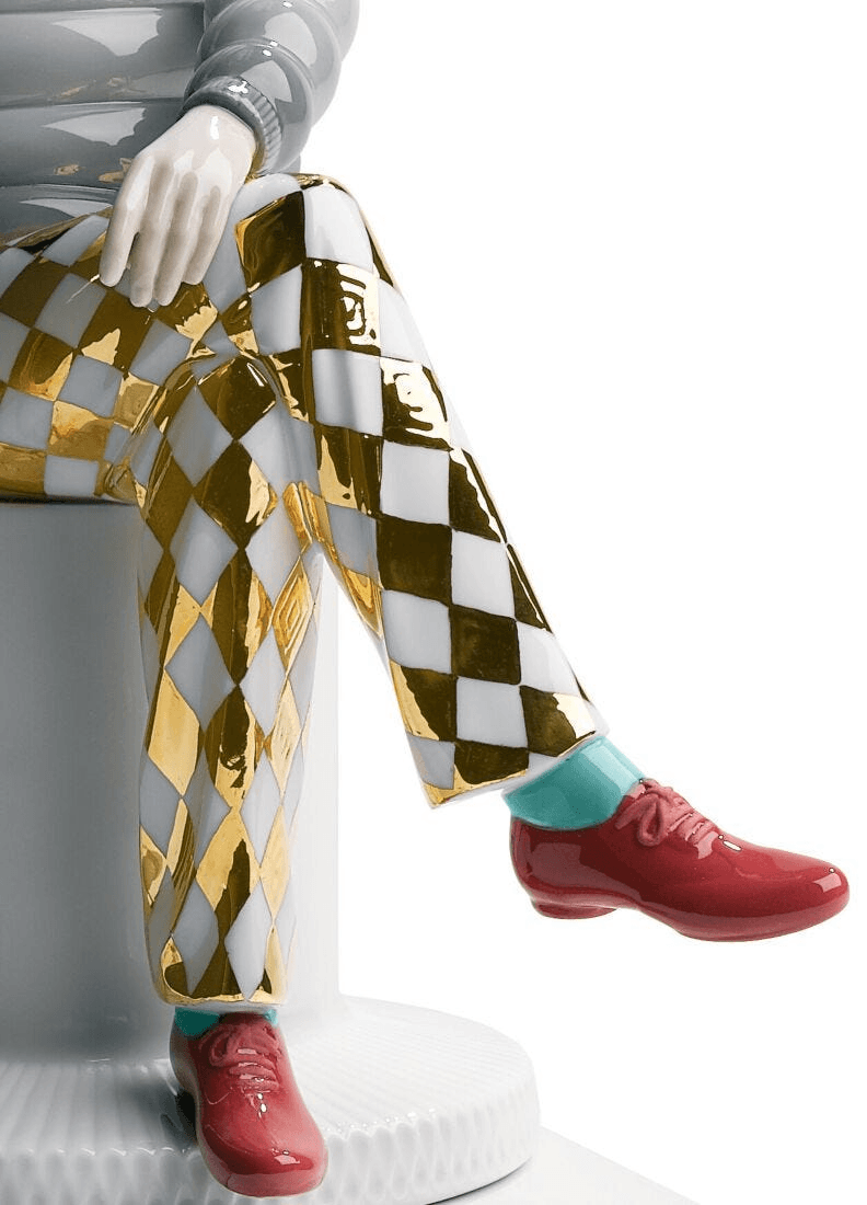 Lladró - The Lover II Sculpture, detailed porcelain figure with gold and white checkered pants and red shoes.