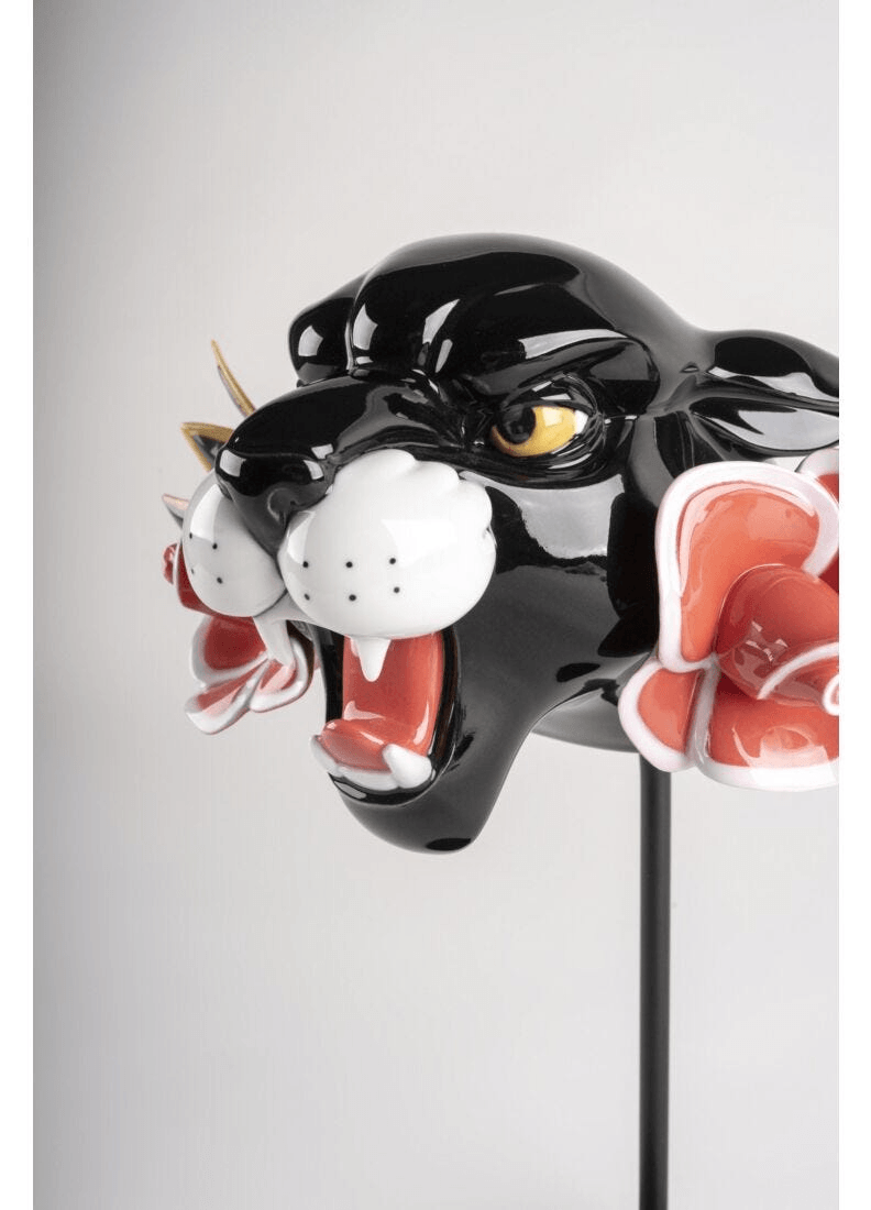 Lladró - Wild Panther Figurine in black porcelain with floral accents, showcasing fierce expression and intricate design.