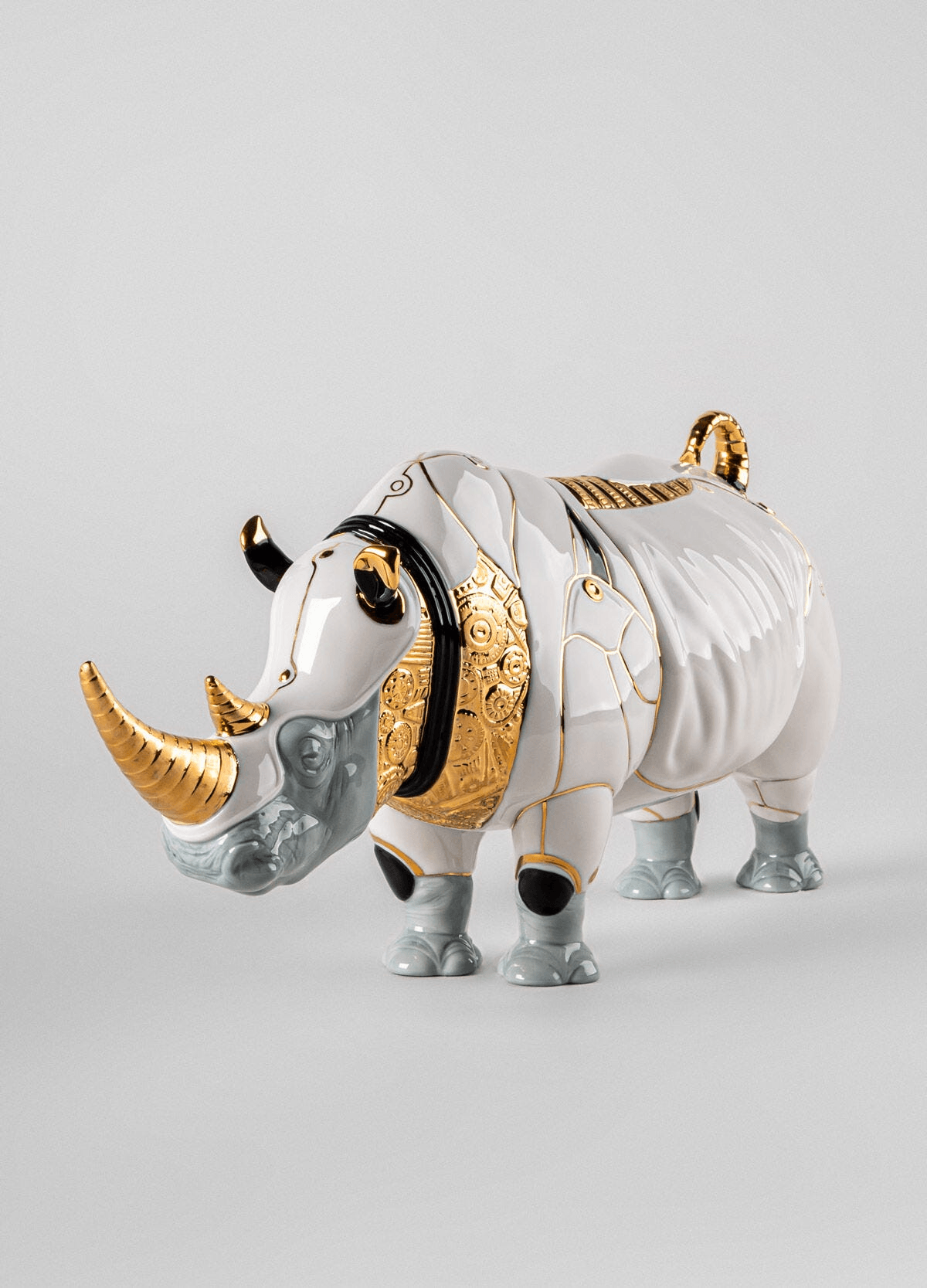 Lladró - Rhino Cyborg Sculpture made of porcelain with intricate details and gold accents.