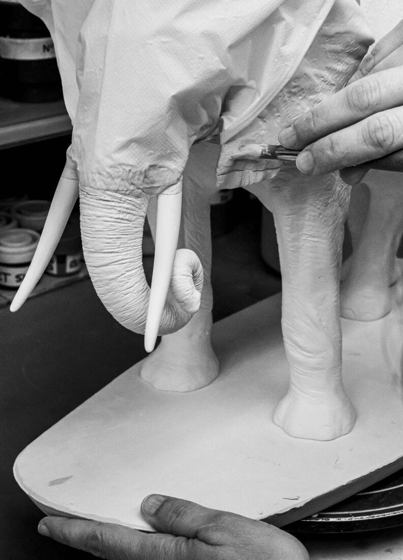 Artist sculpting Lladró - Elephant - Underwater Sculpture in porcelain, showcasing intricate details.