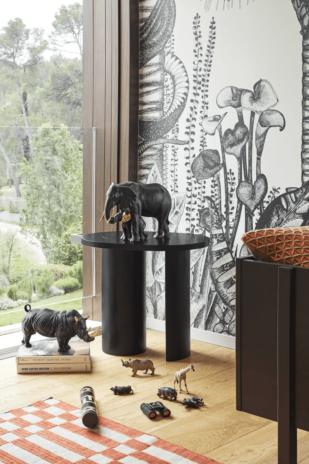 Lladró - Leading the way Sculpture - Black-Gold - Limited Edition displayed on a modern table with decorative animals.