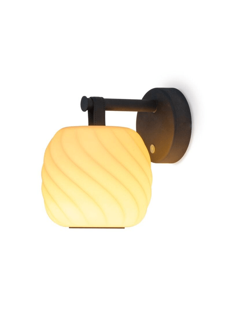 Lladró - Ice Cream Wall Sconce featuring porcelain lamp with warm light and black metallic mount.