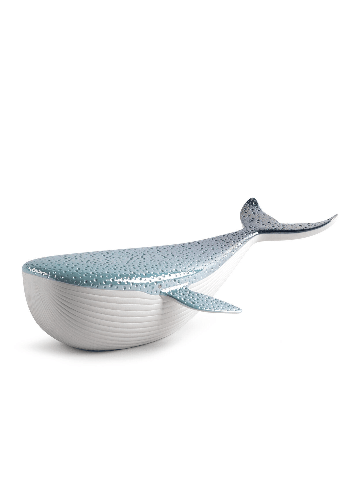 Lladró - Whale porcelain decorative piece in white and blue, symbolizing beauty and nature.