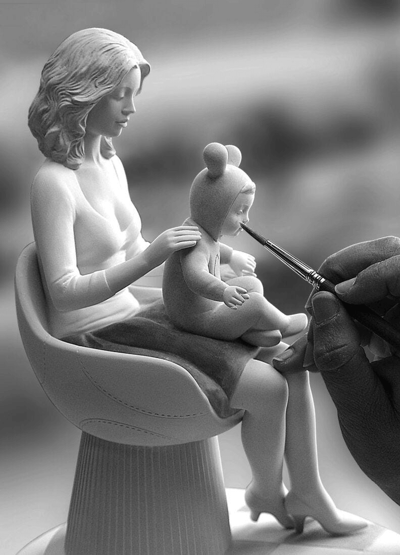Lladró - The Family Portrait Sculpture, a porcelain piece by Jaime Hayon, showcasing a mother and child interaction.