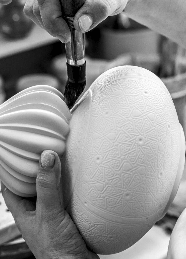 Lladró - Majestic Nights Wireless Lamp crafting process, artist hand brushing porcelain with precision.