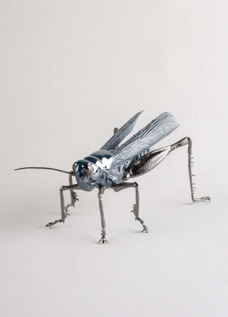 Lladró - Grasshopper Figurine in glazed porcelain with blue pearly luster, symbolizing luck and prosperity.