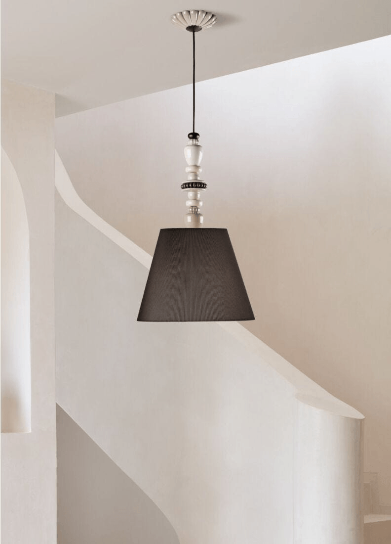 Lladró - Firefly Pendant Light - Pearly in a stylish interior setting with black shade and decorative porcelain elements.