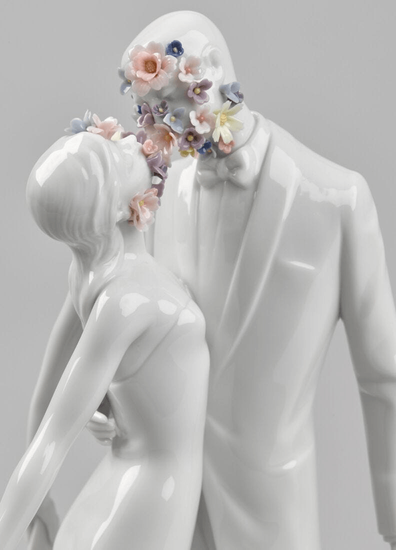 Lladró - Love I (Blossoms) - Sculpture featuring porcelain couple adorned with floral embellishments.