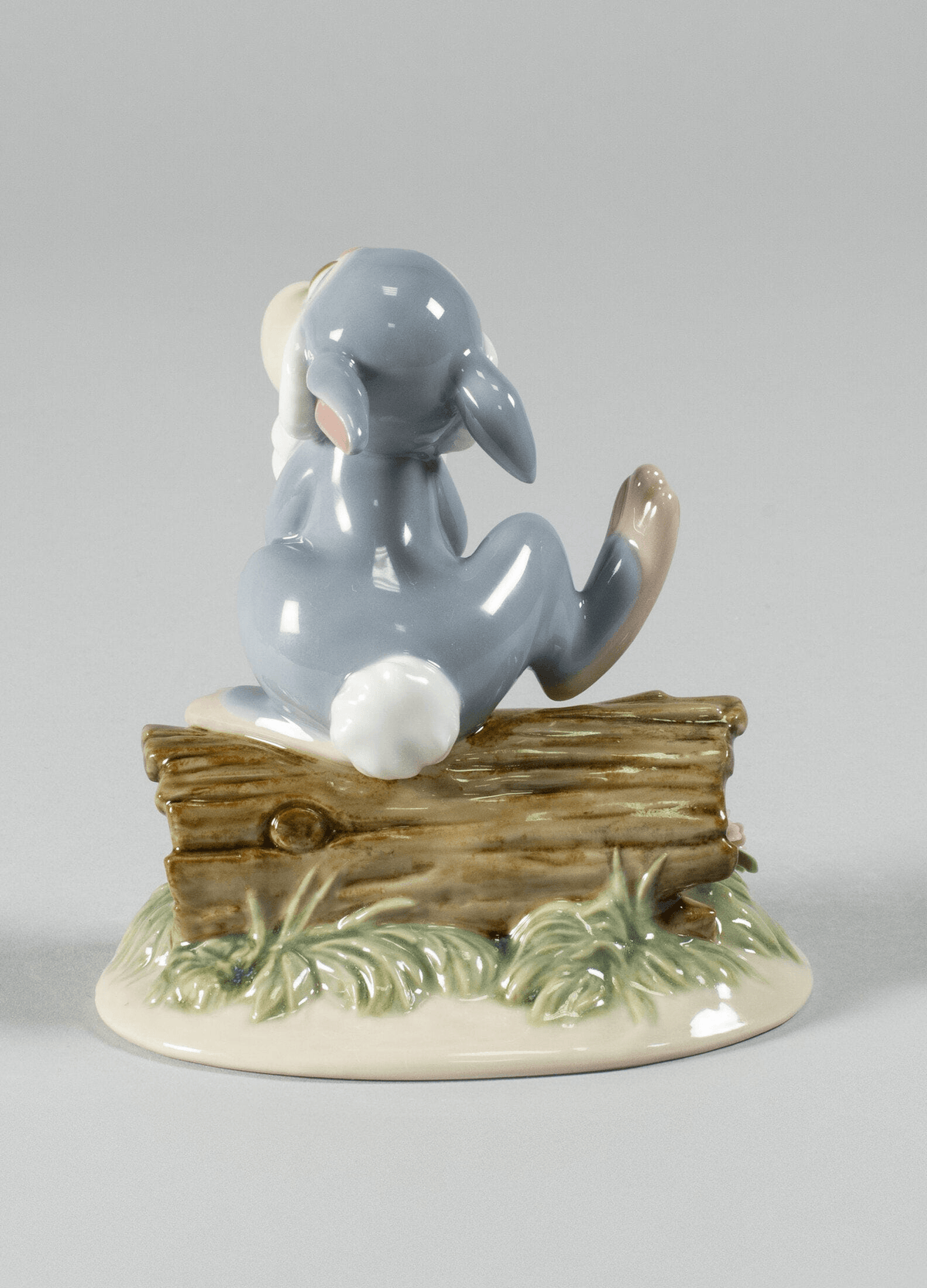 Lladró - Thumper Figurine - Back view of porcelain figurine depicting Thumper on a log, handcrafted in Spain.