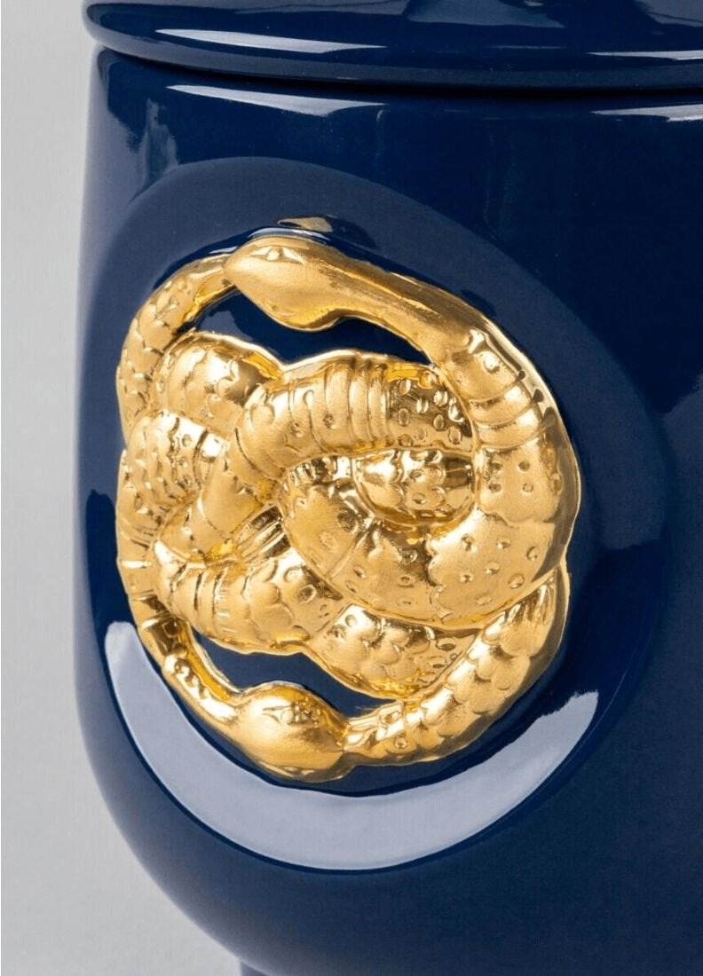 Lladró - Snake candle Luxurious Animals. A Secret Orient Scent featuring a detailed golden snake design on a porcelain holder.
