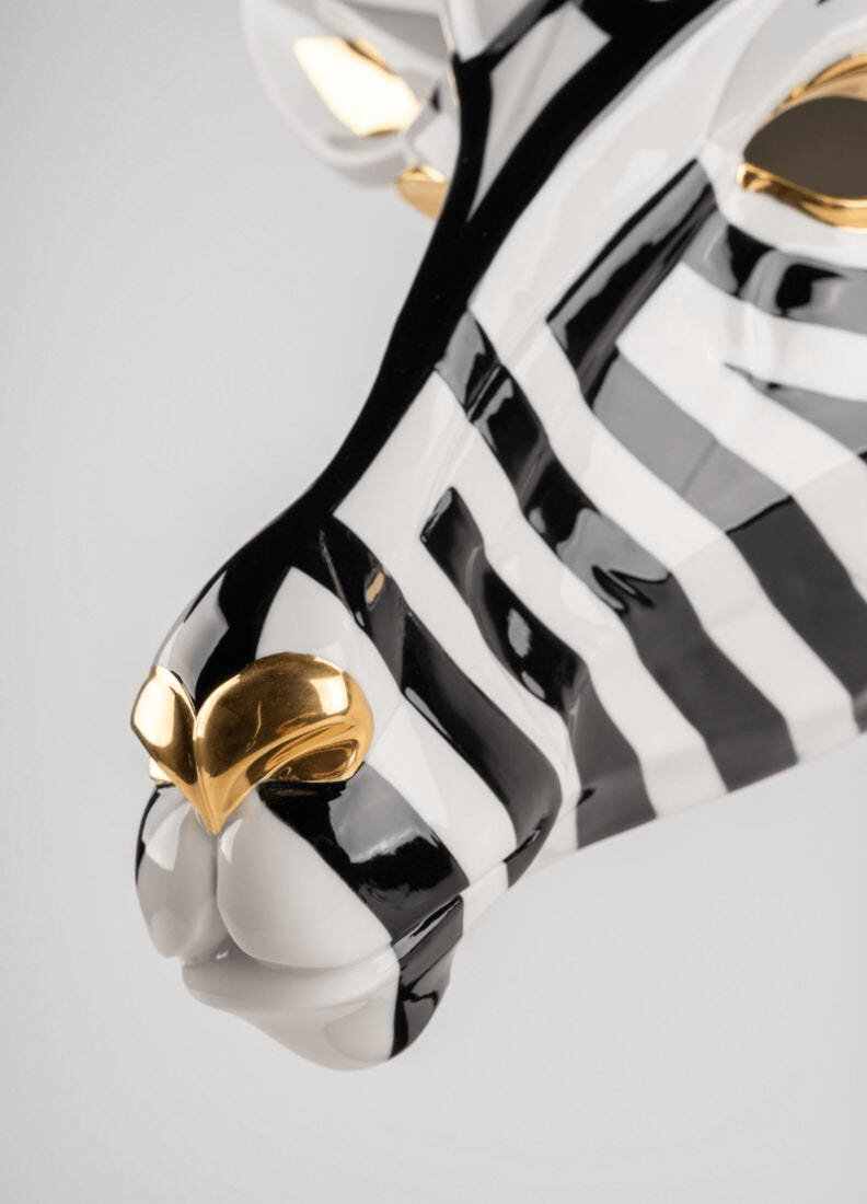 Lladró - Antelope Mask - Black and Gold, a striking porcelain creation with intricate black and gold details.