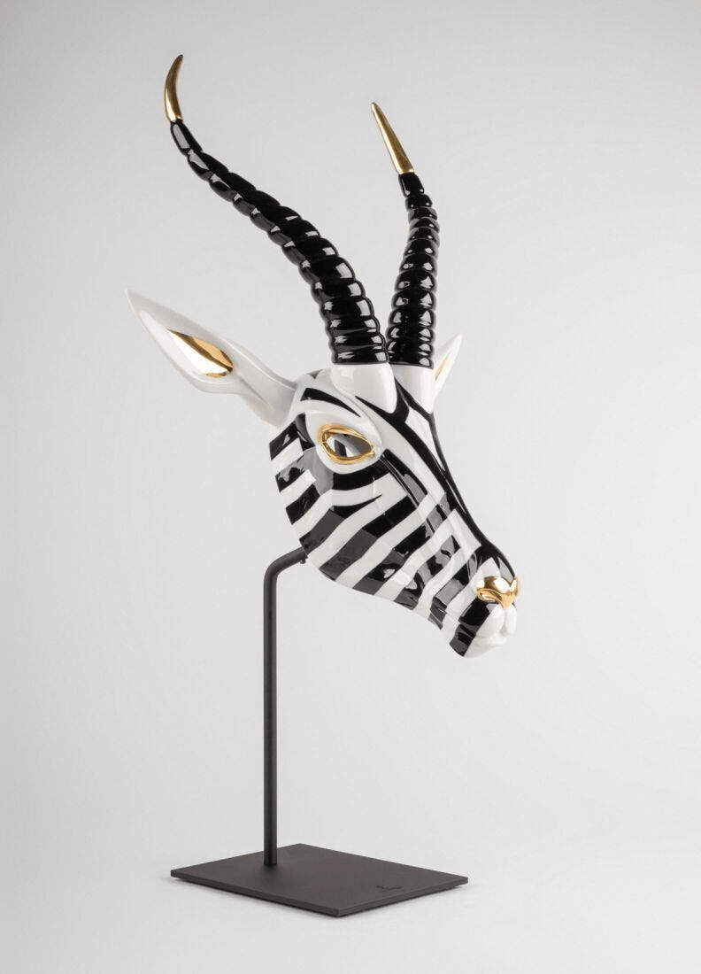 Lladró - Antelope Mask - Black and Gold on display, featuring striking porcelain craftsmanship and elegant design.