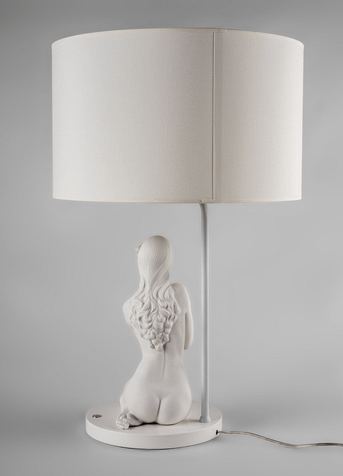 Back view of the Lladró - Inner Peace Table lamp featuring a sculpted female figure in matte white Lladro Porcelain.