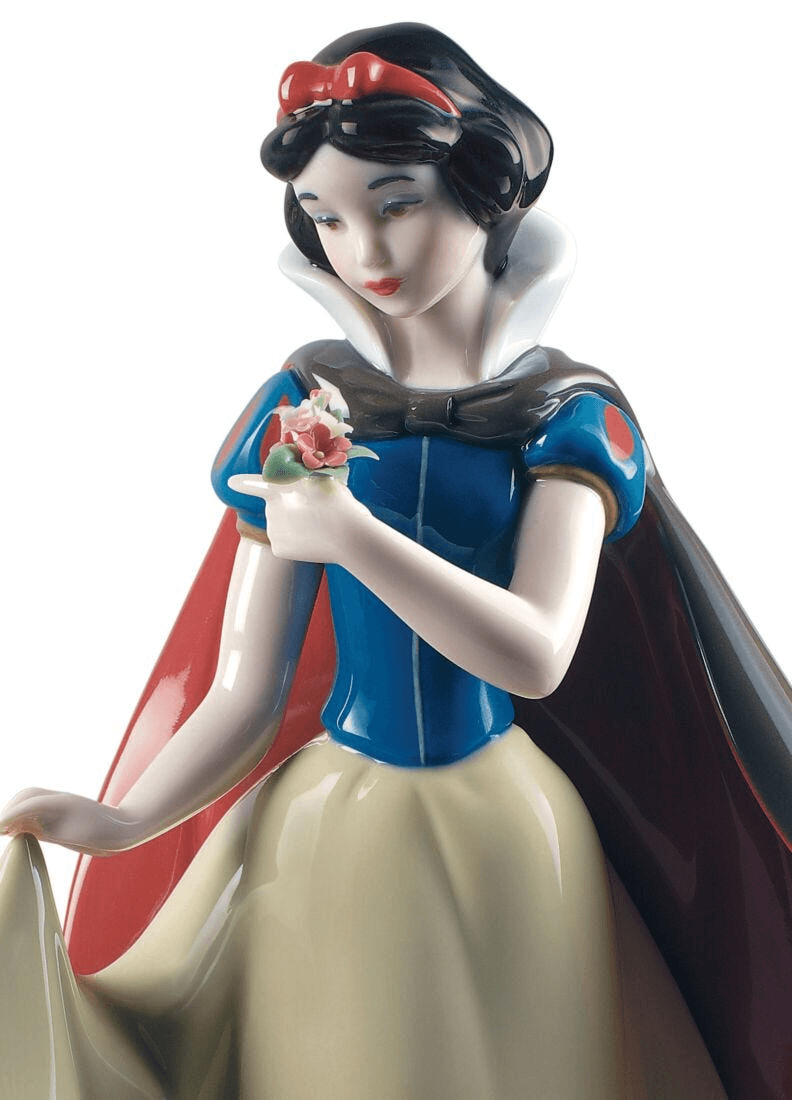 Lladró - Snow White Figurine capturing Snow White holding flowers, intricately crafted porcelain design.