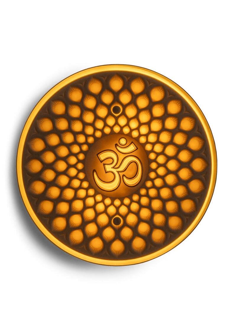 Lladró - Om wall light featuring a golden Om symbol on translucent porcelain with intricate patterns.