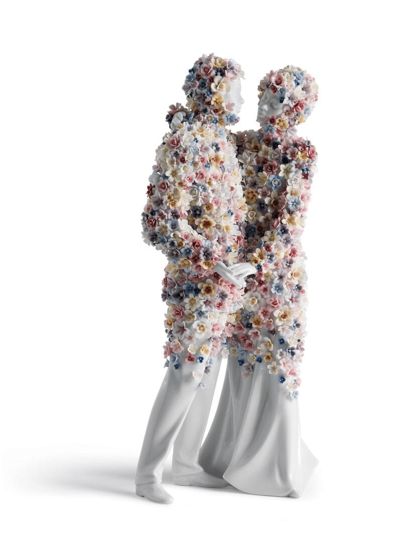 Lladró - Love III (blossoms) Sculpture featuring a romantic couple adorned with colorful porcelain flowers.
