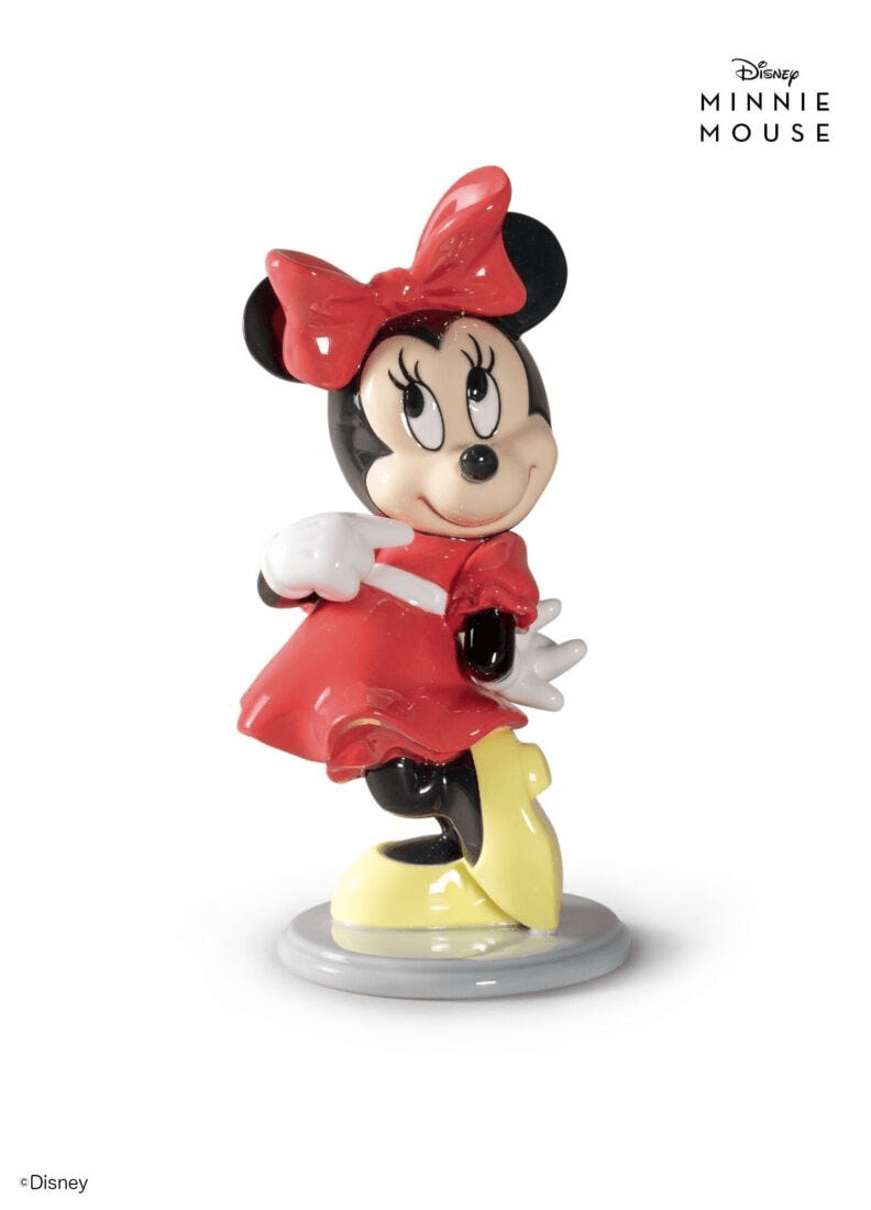 Lladró - Minnie Mouse Figurine in porcelain, whimsical design featuring Minnie in red dress and yellow shoes.
