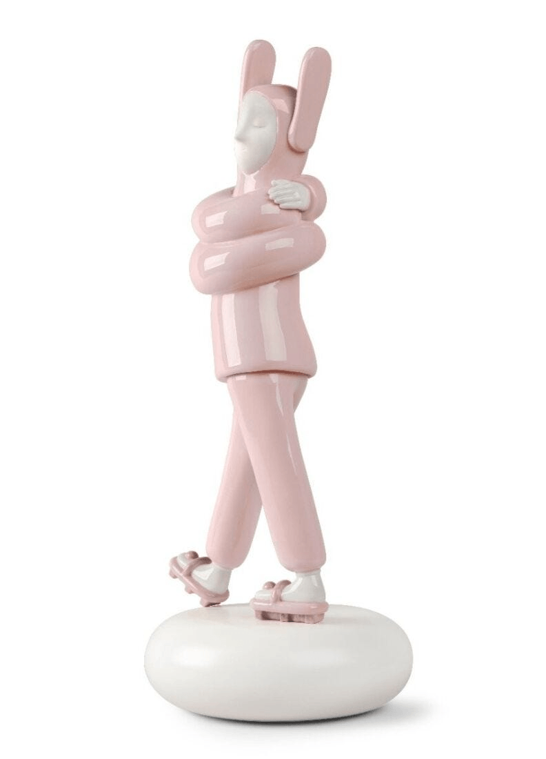 Lladró - Embraced Sculpture - Pink, porcelain figurine of a character hugging itself, designed by Jaime Hayon.
