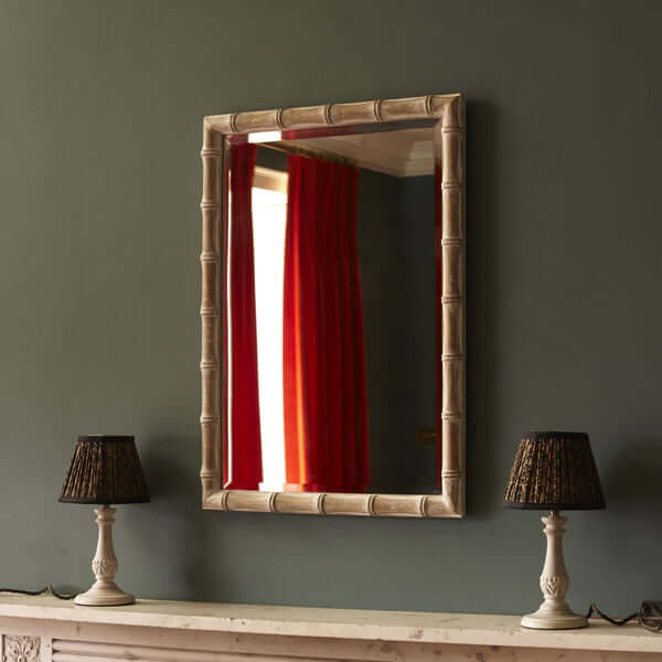 Pooky - Baloo Mirror - Natural Whitewash Finish hanging above stylish lamps on a green wall.