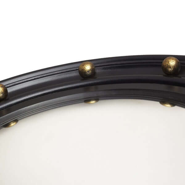 Close-up of the Pooky - Lauren Mirror frame showing golden baubles and a sleek design.
