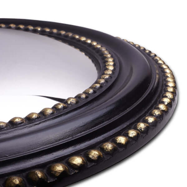Pooky - Marilyn Mirror close-up showing black frame with gold detailing and convex design.