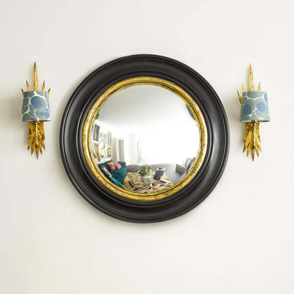 Pooky - Marlon Convex Mirror - Black and Gold showcasing its elegant frame and reflective design on a wall.