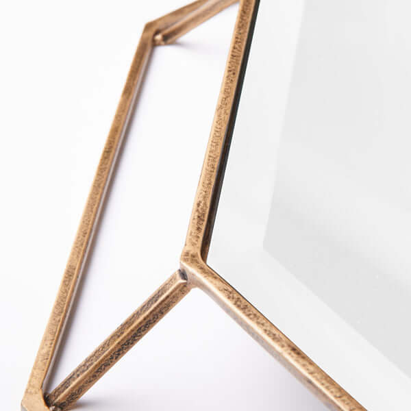 Pooky - Octagon Mirror - Clear Glass with Antique Gold Frame showing metal frame detail.