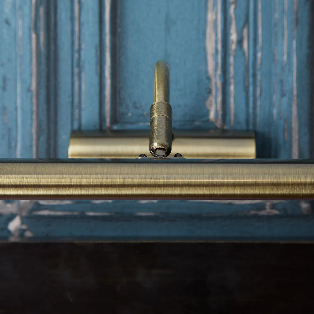 Pooky Smaller Turner Picture Wall Light in antique brass finish