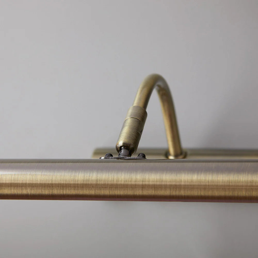 Pooky Larger Turner Picture Wall Light in antique brass finish