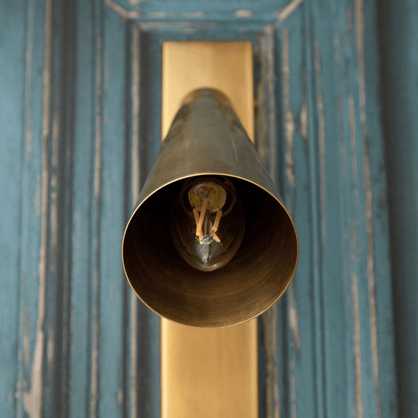 Pooky - Victor Wall Light - Antique Brass close-up view showcasing the elegant design and lighting fixture.