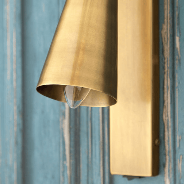 Pooky - Victor Wall Light - Antique Brass close-up showcasing elegant design and directed beam.