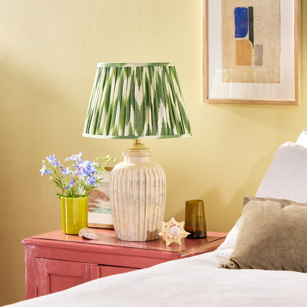 Pooky - Smaller Marcie Table Lamp Base - Natural Whitewash styled on a pink bedside table.