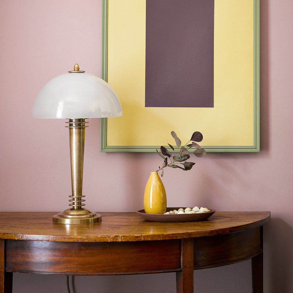 Art Deco Pooky - Pietro Table Lamp - Brass and Glass on a wooden half-moon table.